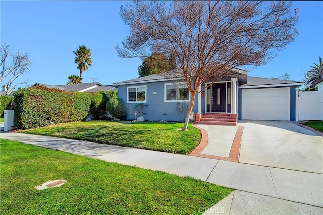 ranch-style home featuring a front yard and a garage