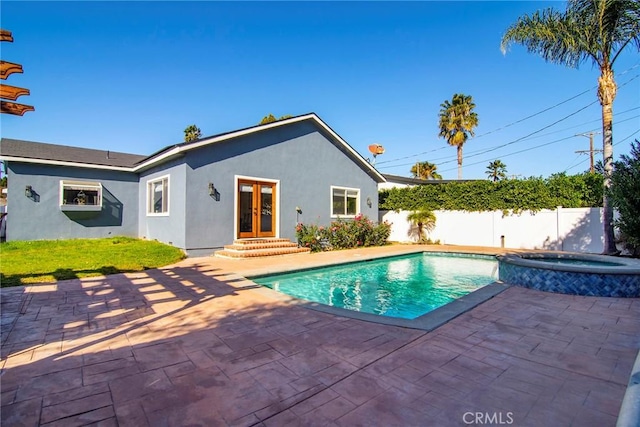 view of pool featuring an in ground hot tub, french doors, and a patio