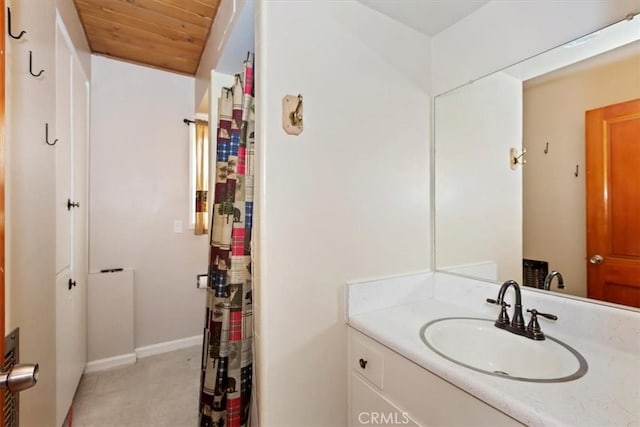 bathroom featuring vanity and wood ceiling