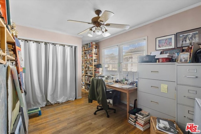 home office featuring crown molding, wood-type flooring, and ceiling fan