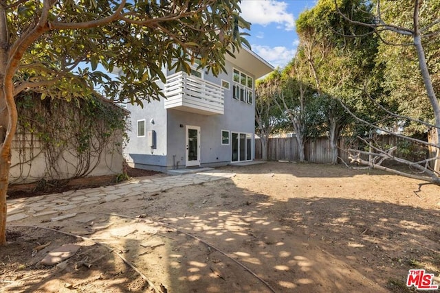 rear view of property with a patio area