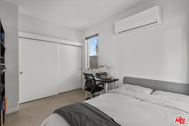 bedroom with a wall mounted AC and a closet