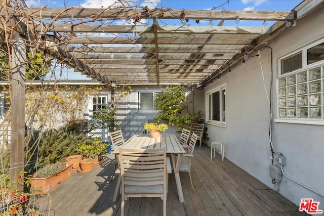 wooden deck featuring a pergola