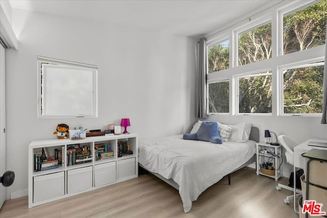 bedroom with light wood-type flooring