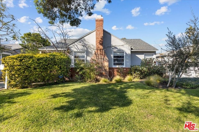 exterior space with a lawn