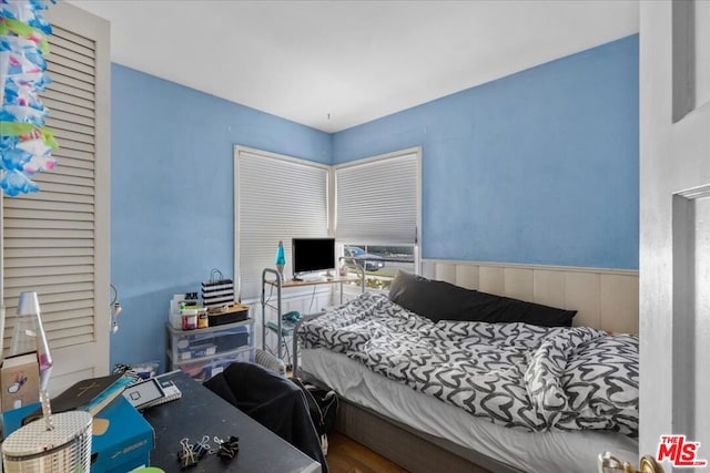 bedroom with hardwood / wood-style flooring