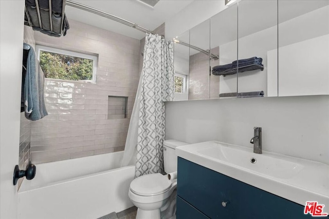 full bathroom with vanity, toilet, and shower / bath combo with shower curtain