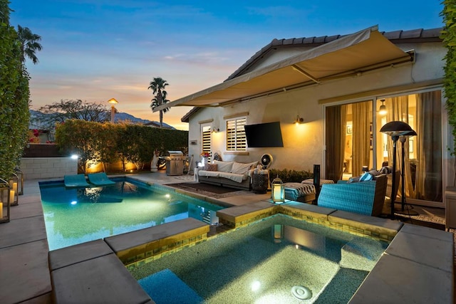 view of swimming pool with an in ground hot tub, a patio area, and outdoor lounge area