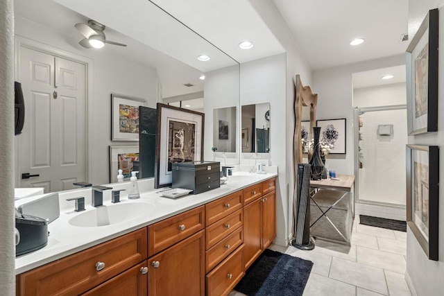 bathroom featuring vanity, ceiling fan, a shower with door, and tile patterned flooring