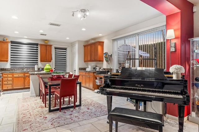 kitchen with light tile patterned flooring