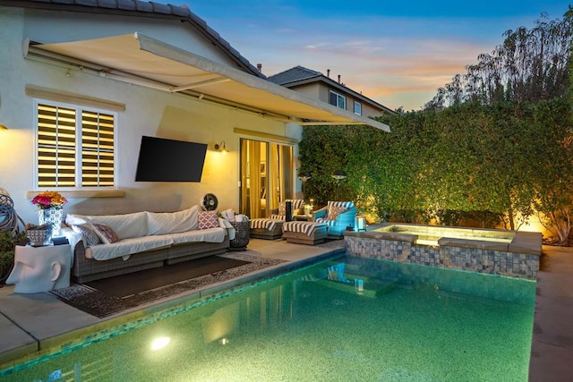 view of swimming pool with an in ground hot tub, outdoor lounge area, and a patio