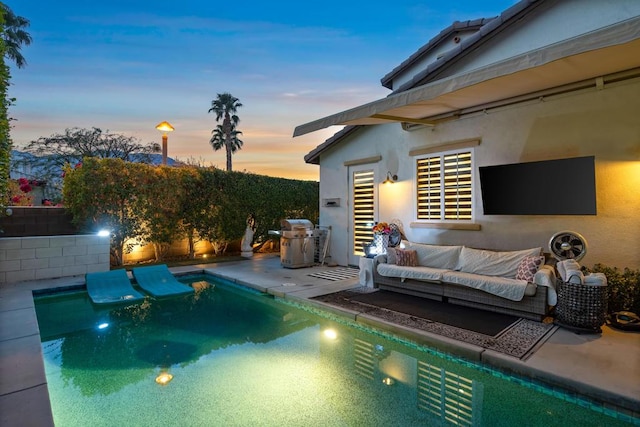 view of pool featuring an outdoor living space, a patio, and area for grilling