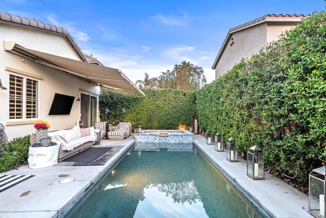 view of pool with an in ground hot tub, a patio, and outdoor lounge area