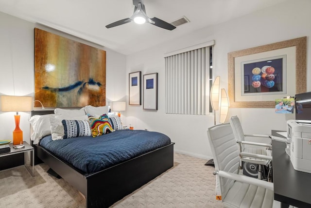 bedroom featuring light carpet and ceiling fan