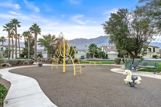 view of jungle gym featuring a mountain view