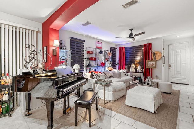 interior space featuring ceiling fan and light tile patterned flooring