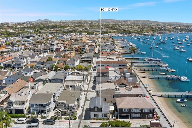 birds eye view of property featuring a water and mountain view