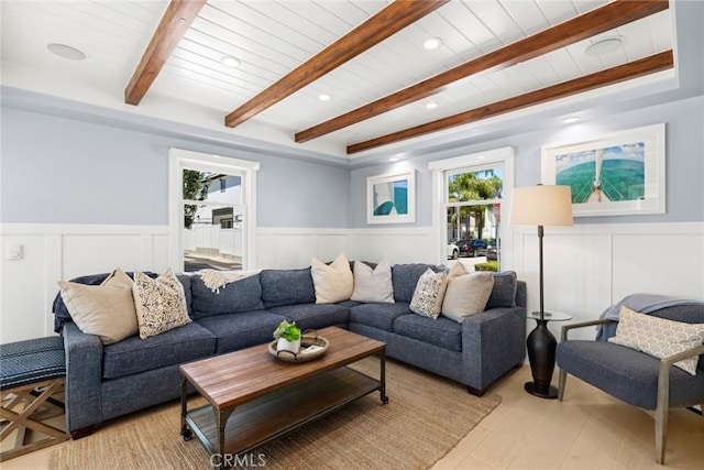 living room featuring beam ceiling, wood ceiling, and light wood-type flooring