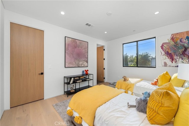 bedroom with light hardwood / wood-style floors