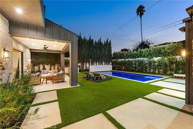 exterior space with ceiling fan, an outdoor hangout area, a yard, and a patio