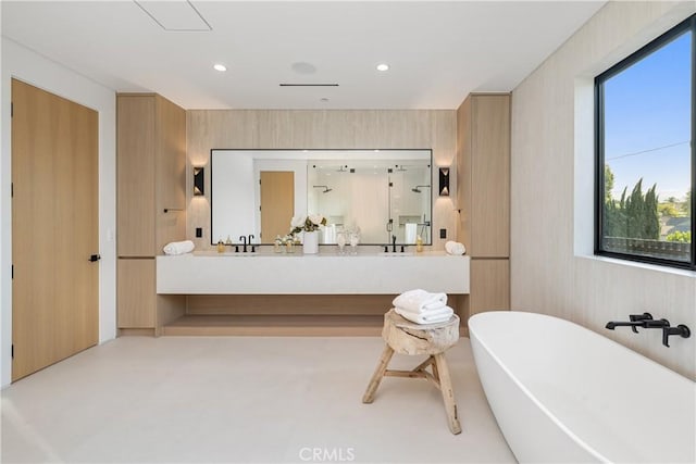 bathroom with vanity and a bathing tub