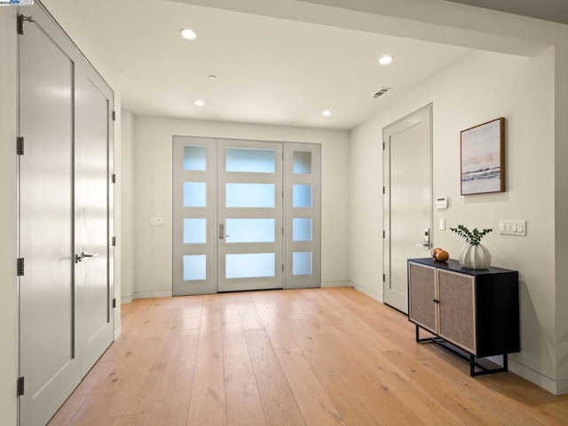 doorway with light hardwood / wood-style flooring