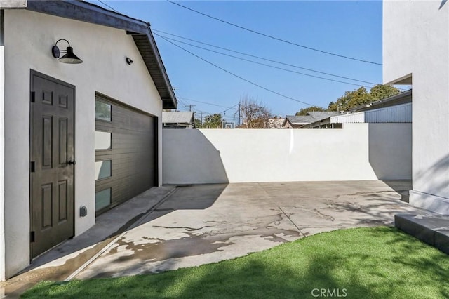 view of side of home featuring a patio