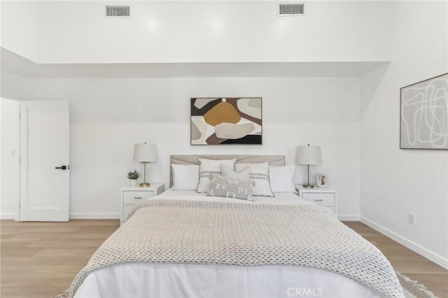 bedroom with light hardwood / wood-style floors