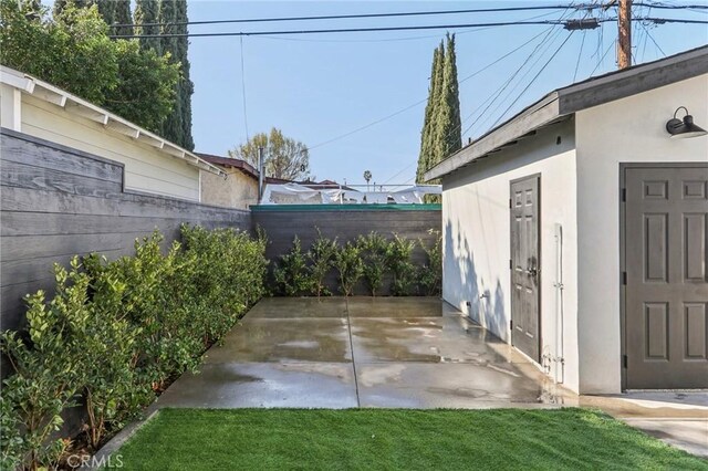 view of patio / terrace featuring an outbuilding