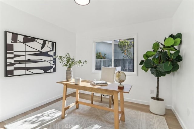 office space with light hardwood / wood-style floors