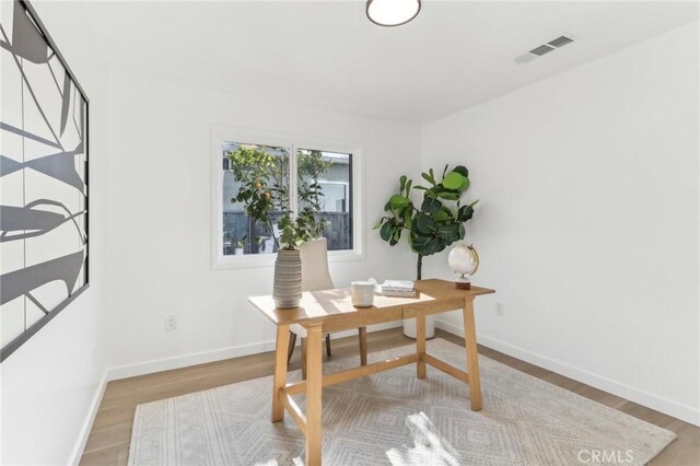 home office featuring light wood-type flooring