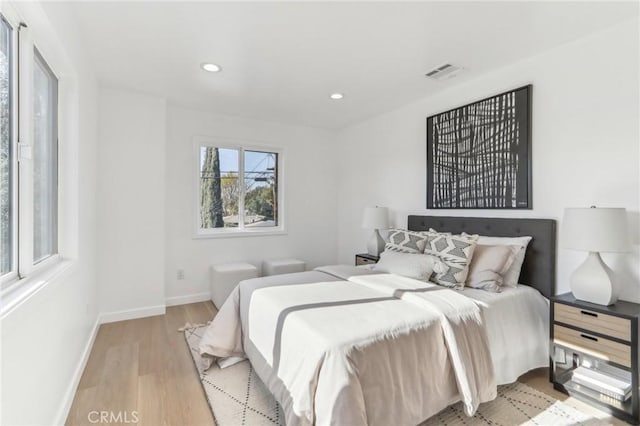 bedroom with light hardwood / wood-style floors