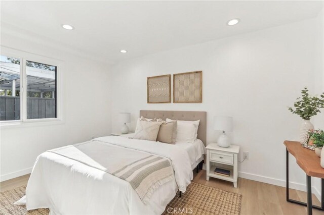 bedroom with light wood-type flooring