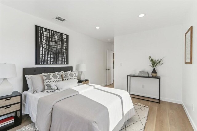 bedroom featuring light wood-type flooring