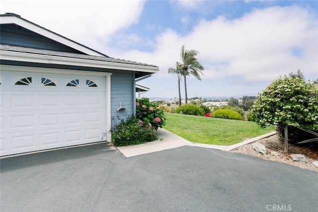 garage with a yard