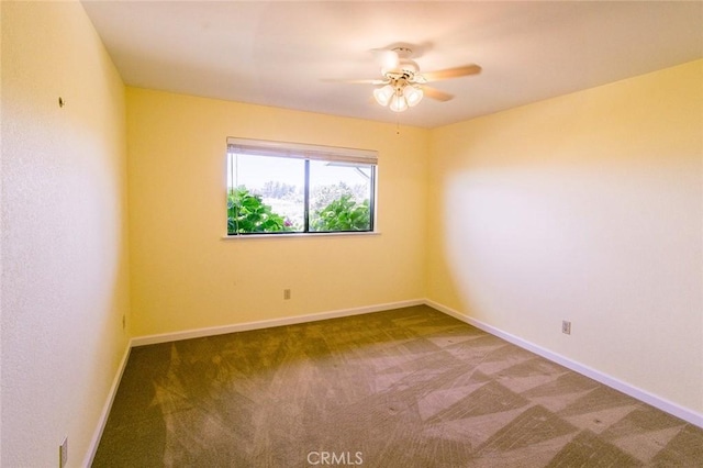 carpeted empty room with ceiling fan