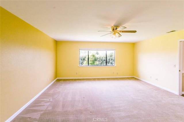 empty room with carpet and ceiling fan