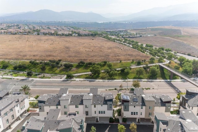 birds eye view of property featuring a mountain view