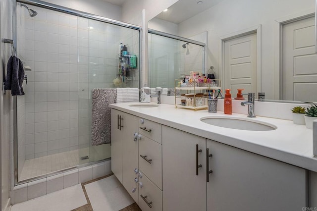 bathroom with vanity, tile patterned flooring, and a shower with shower door