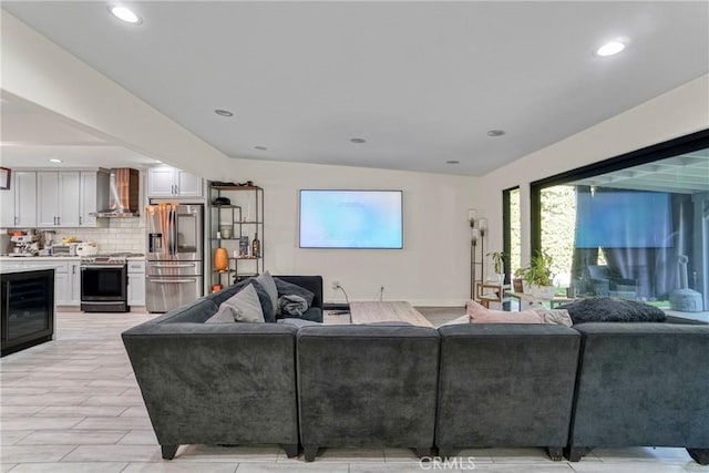 living area with beverage cooler and recessed lighting