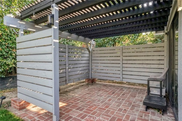 view of patio featuring a pergola