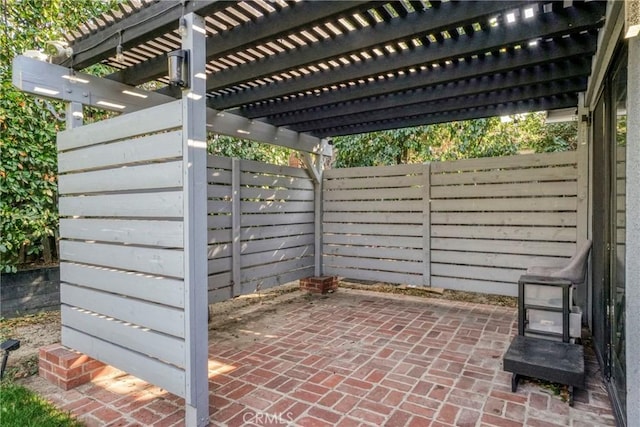 view of patio with a fenced backyard and a pergola