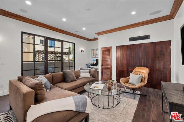 living room featuring dark wood-type flooring and crown molding