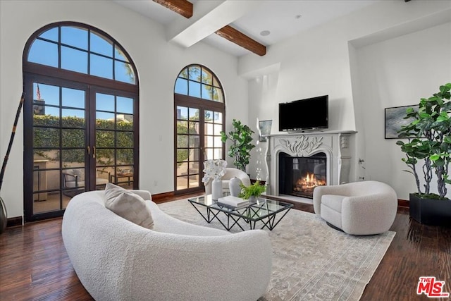 living room featuring french doors, dark hardwood / wood-style flooring, and beamed ceiling