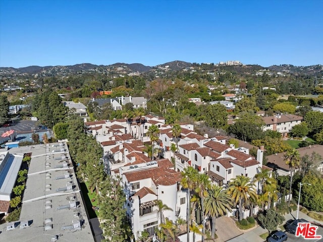 birds eye view of property featuring a mountain view