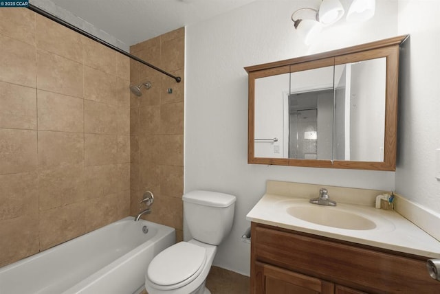 full bathroom with tiled shower / bath combo, toilet, and vanity