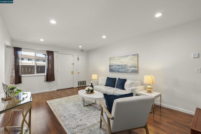 living room featuring dark hardwood / wood-style floors