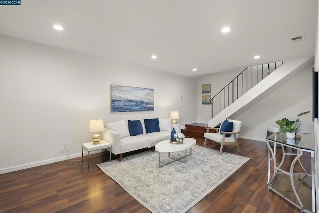 living room with dark hardwood / wood-style floors