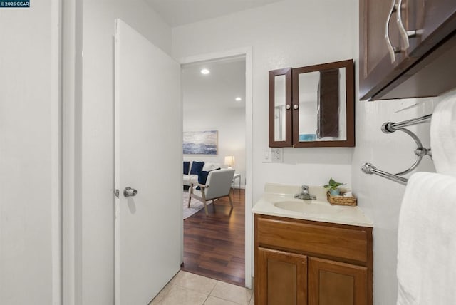 bathroom with tile patterned flooring and vanity