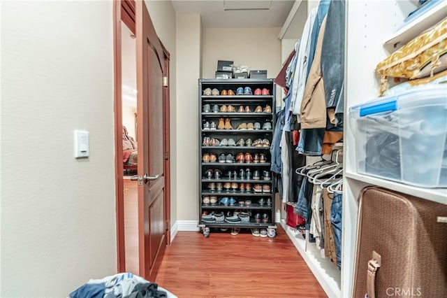 walk in closet featuring wood-type flooring